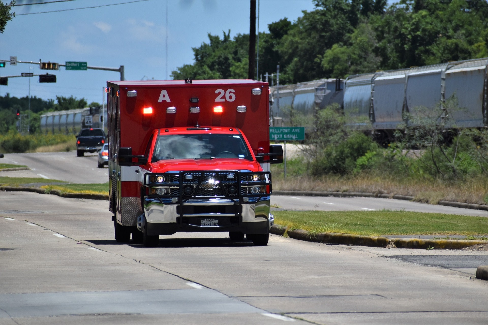 An ambulance with sirens on