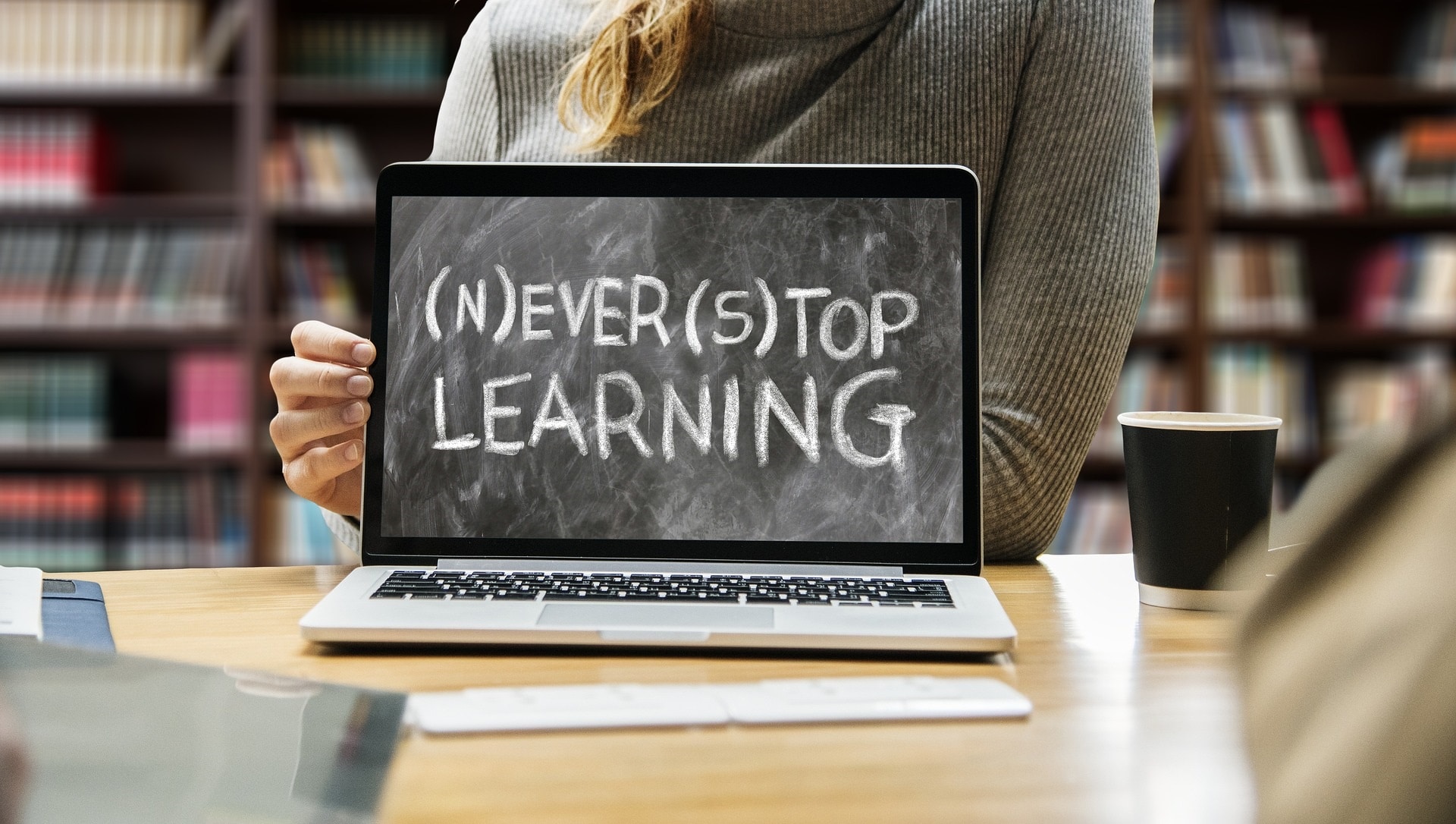 Woman with a laptop and motivational message