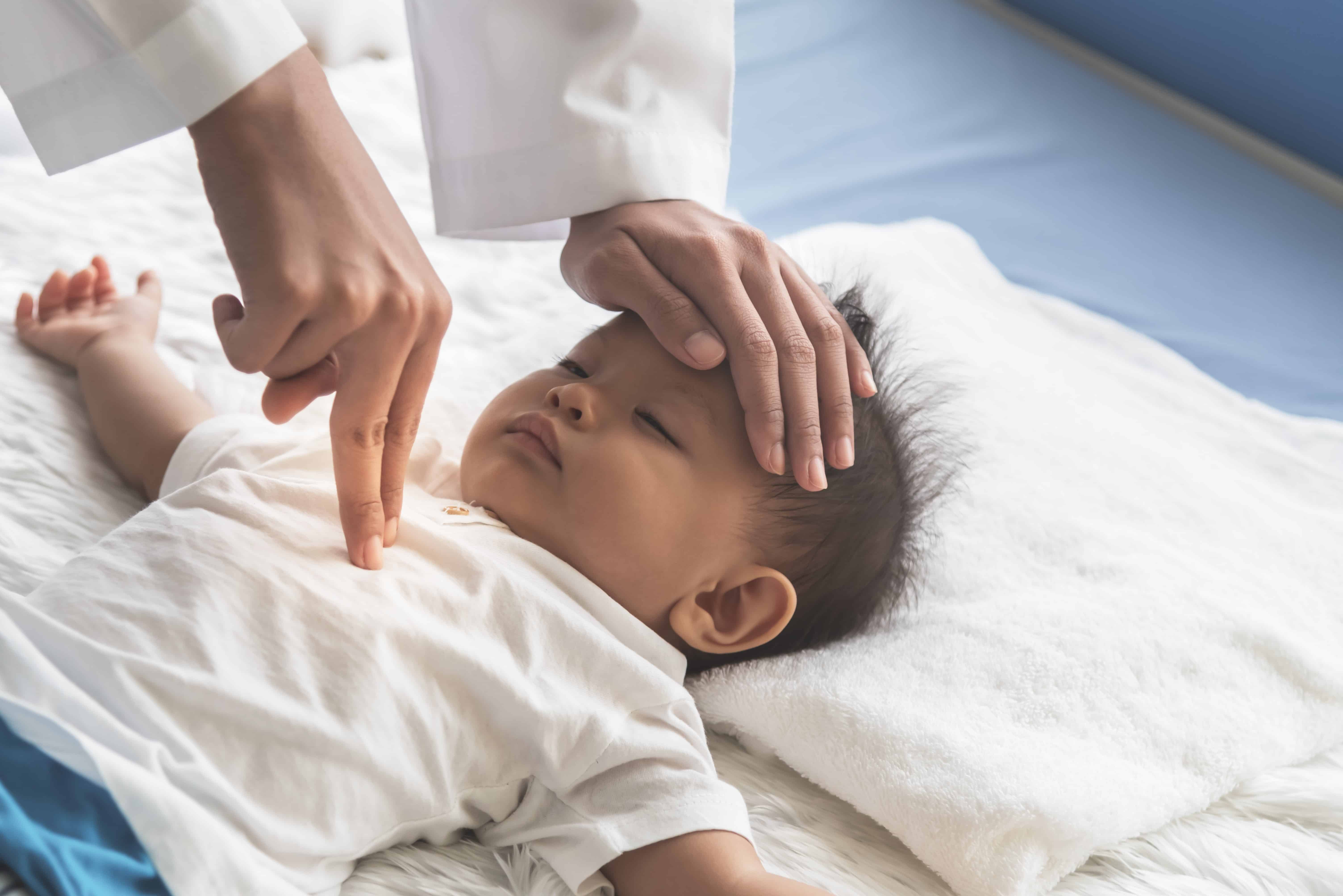 Doctor performing infant CPR