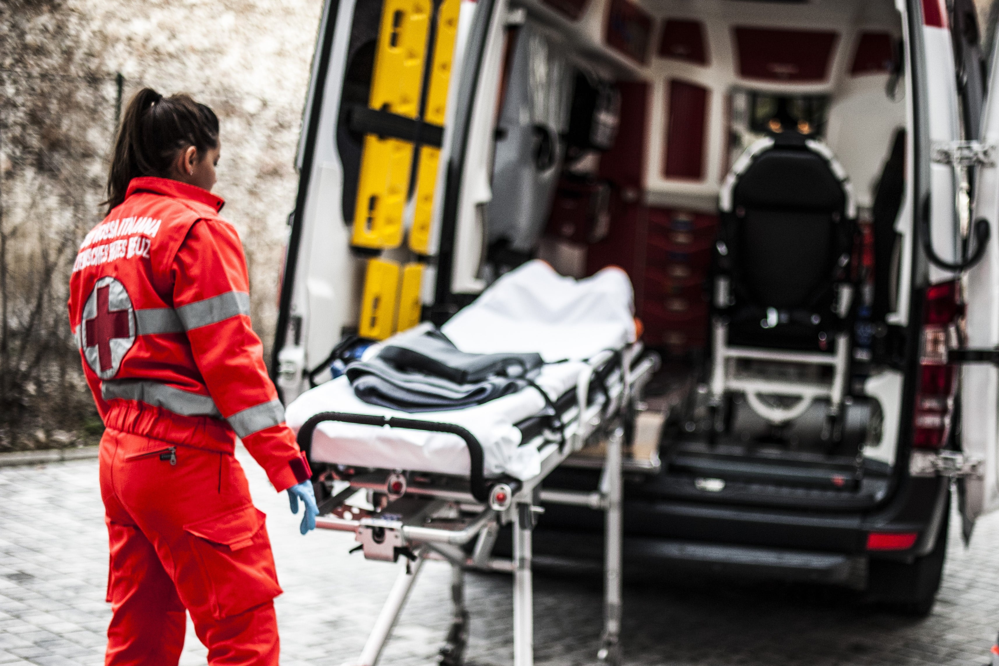 EMS worker moving a stretcher