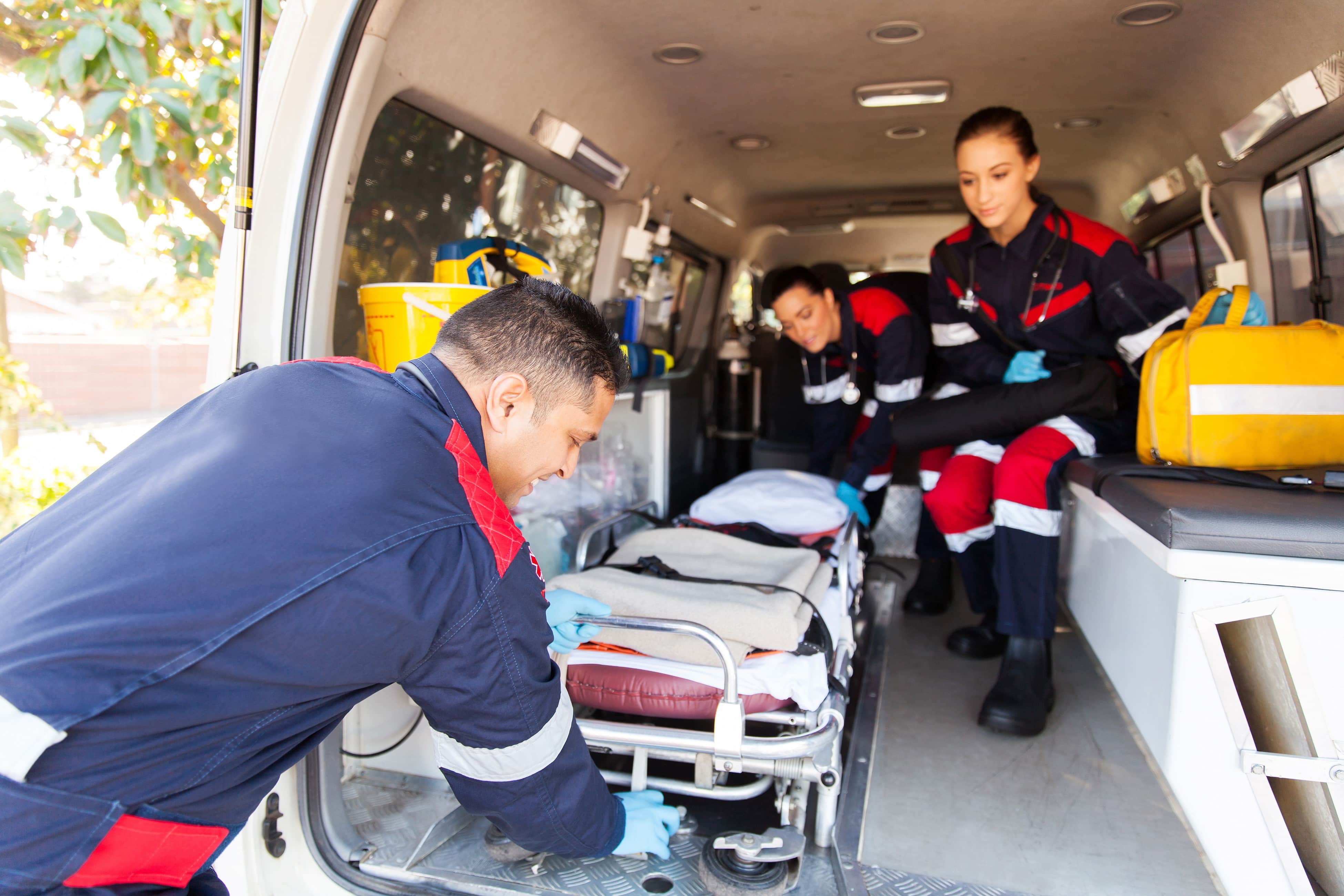 Team of EMS professionals with a stretcher
