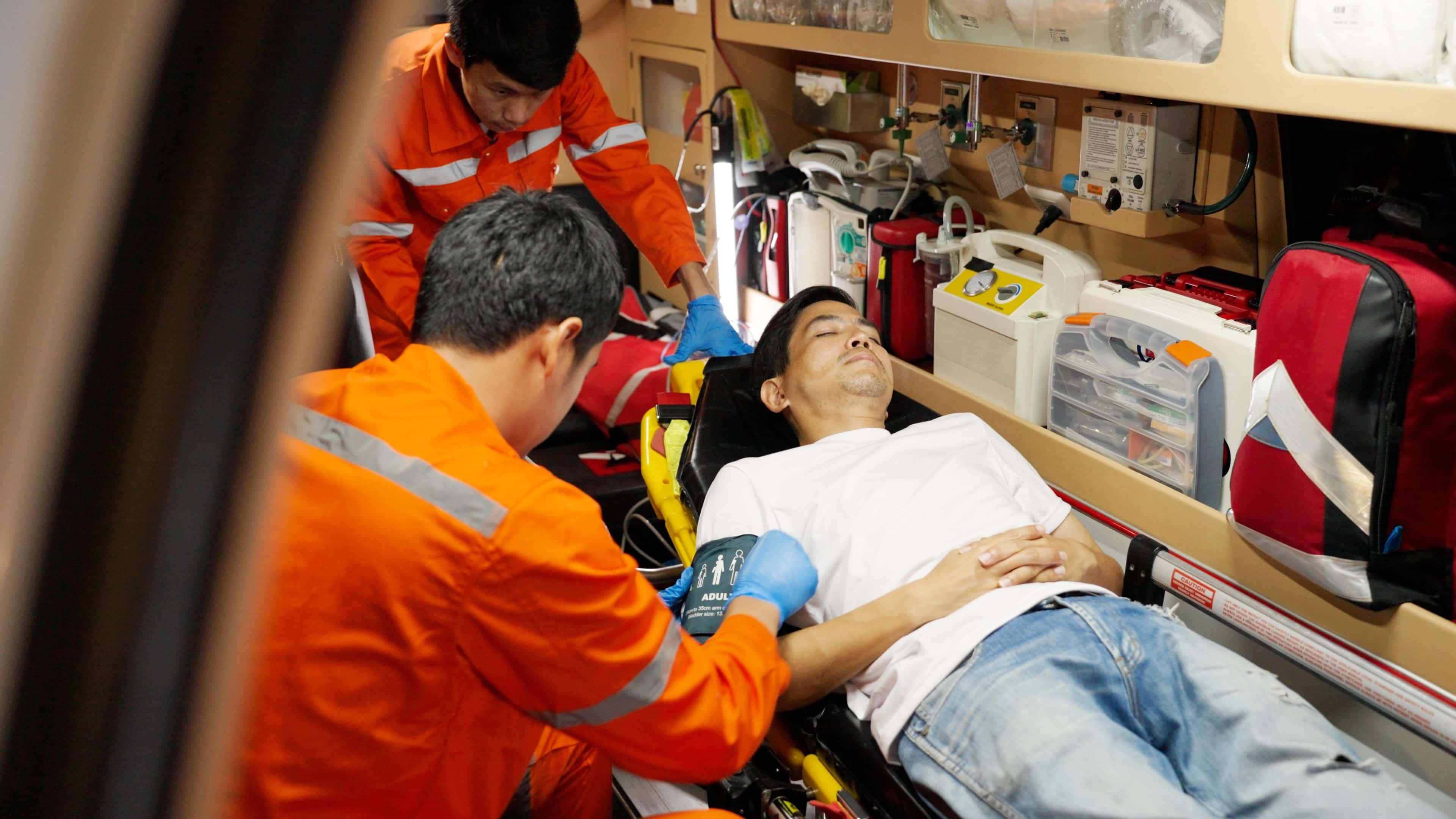 EMS professionals inside an ambulance