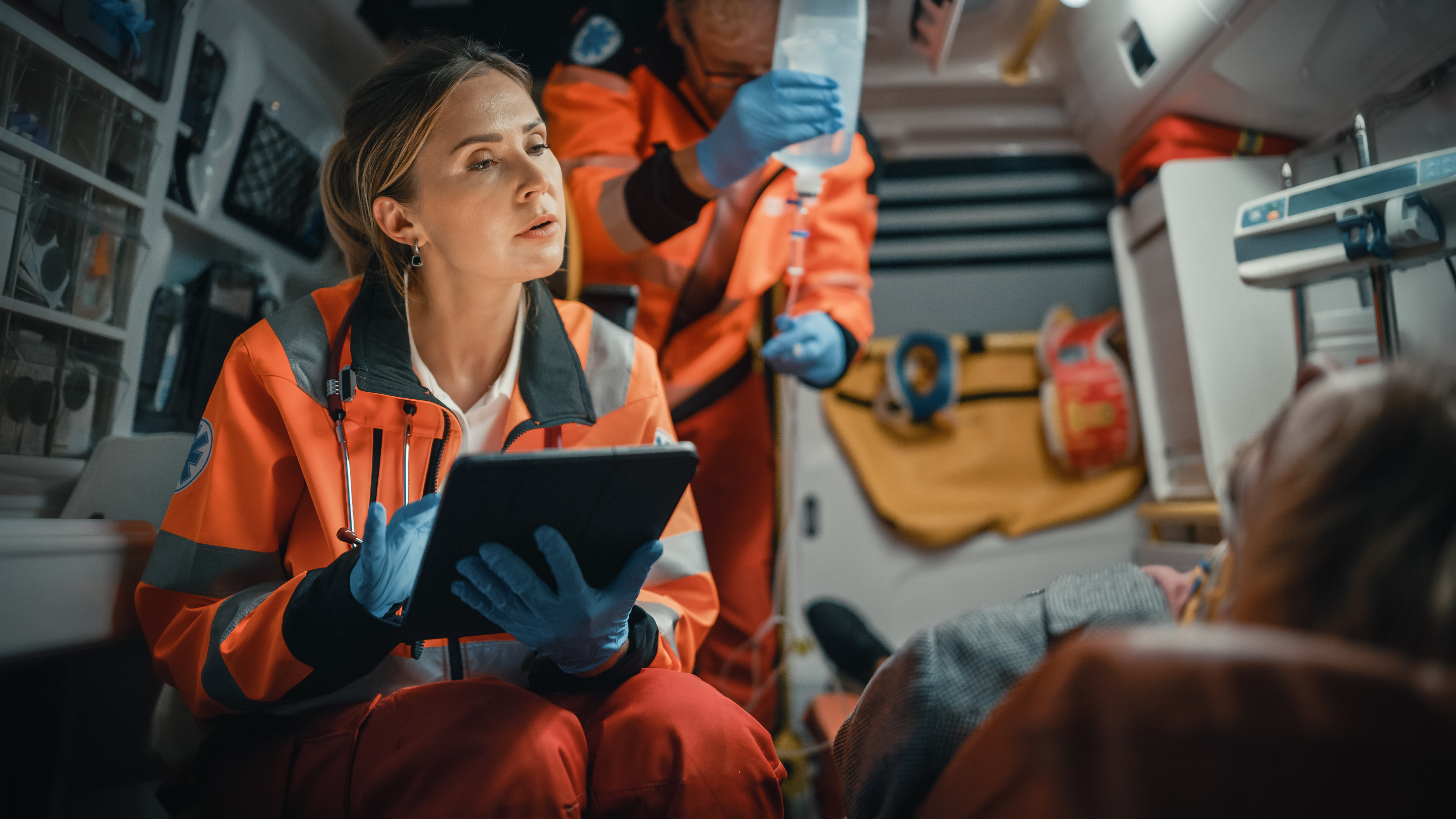 Female EMS professional using a tablet