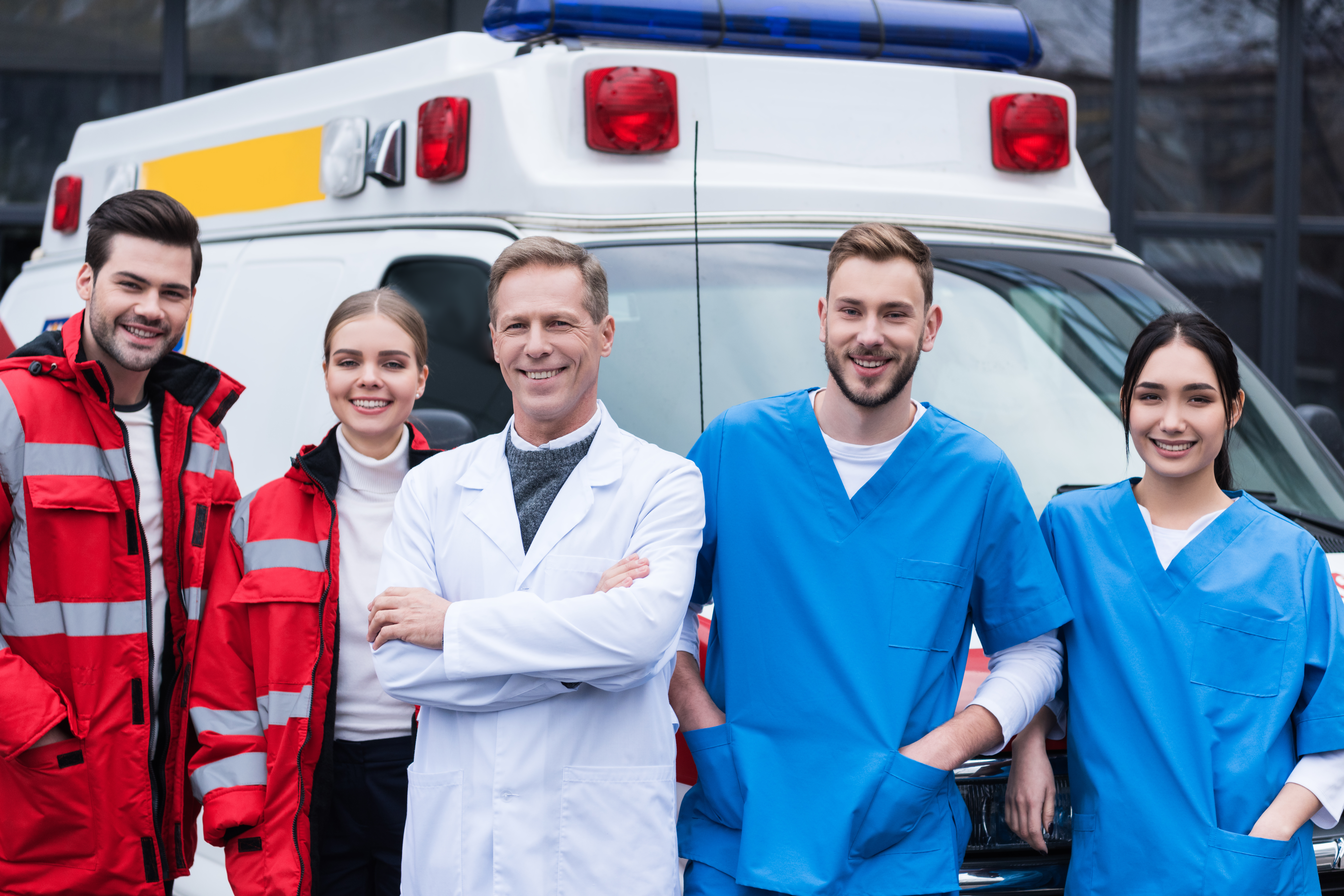 Happy EMS workers with doctors and nurses