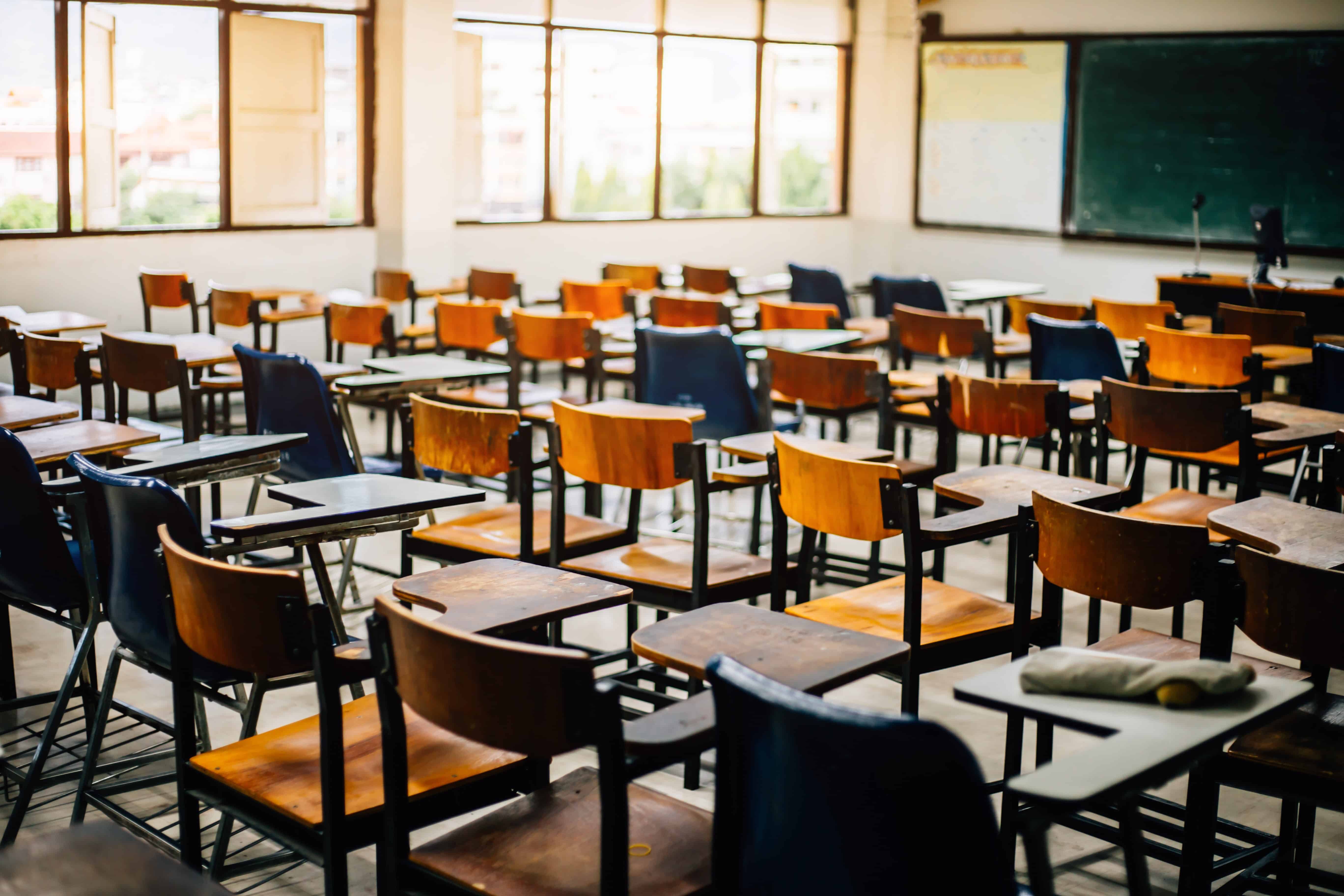 Empty rows of seats in a school classroom