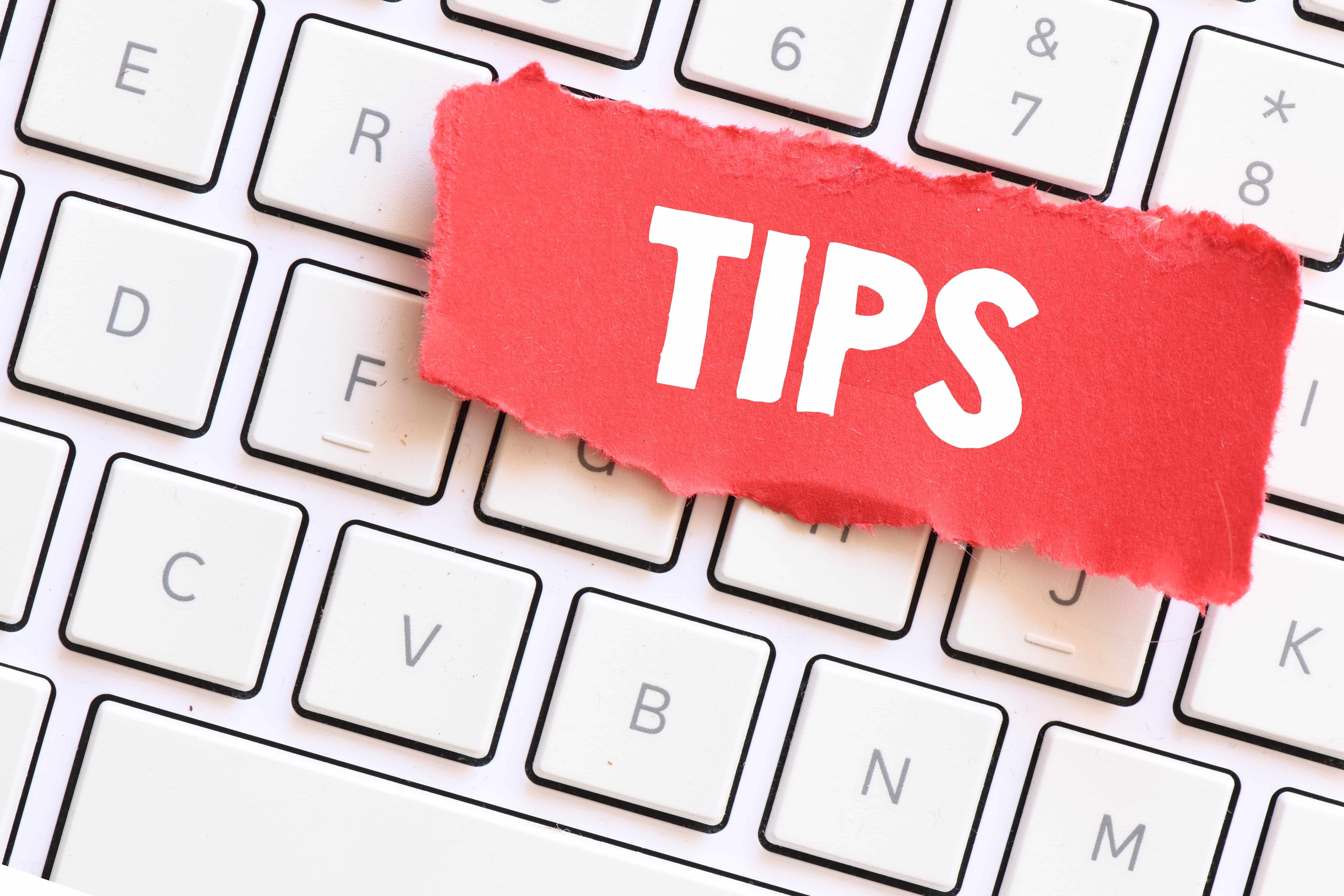 Piece of paper that says TIPS on a keyboard