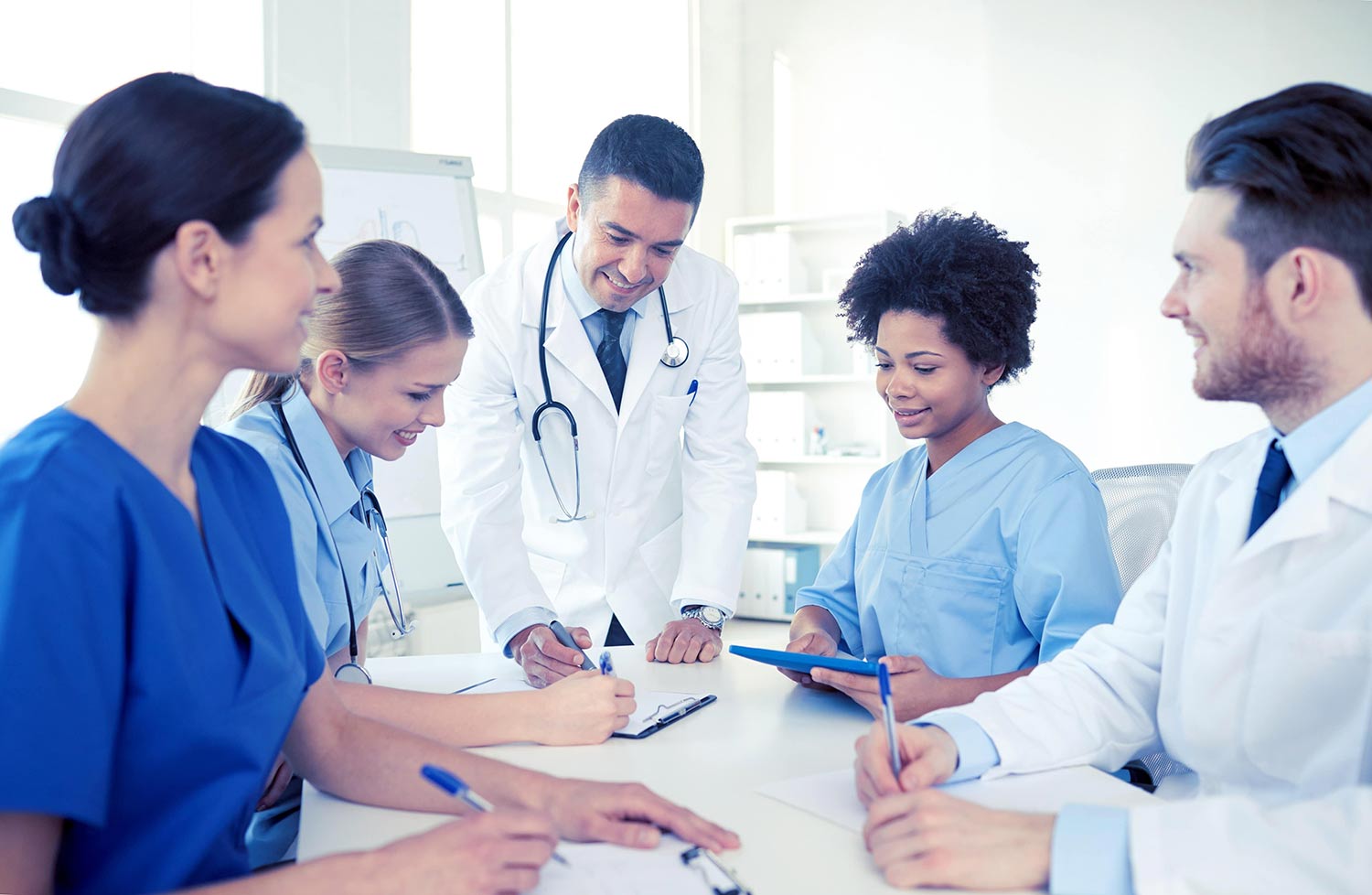 Diverse medical professionals at a conference table